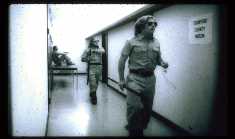 Experiment participants who had the role of a ‘guard’, pictured walking in the prison yard.
